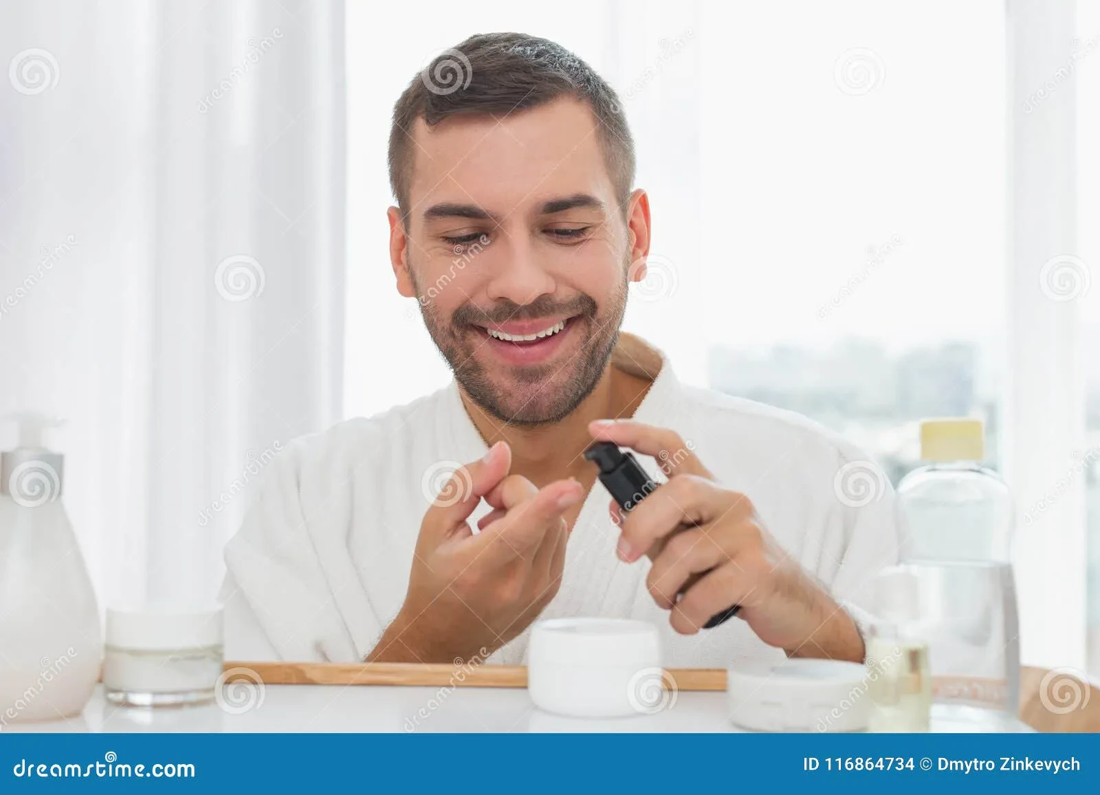 man applying face wash