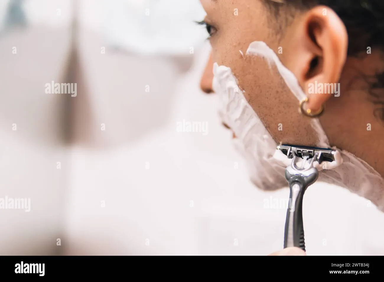 man shaving carefully