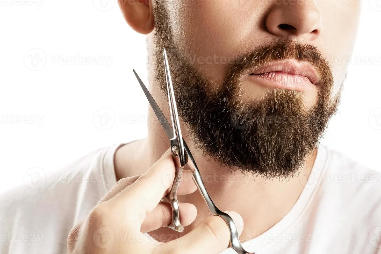 man trimming beard